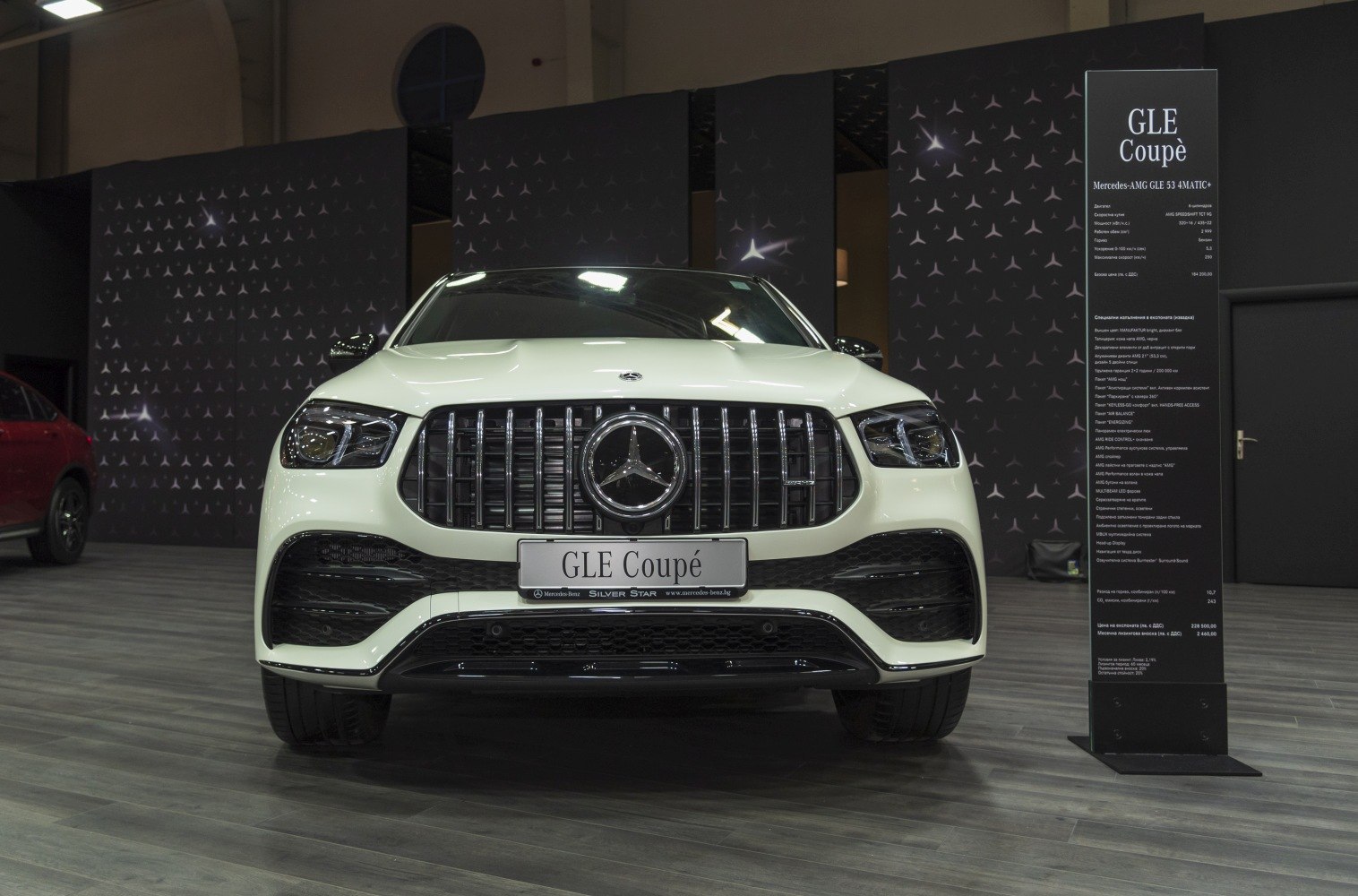 Front view featuring vertical grille and distinctive LED headlights