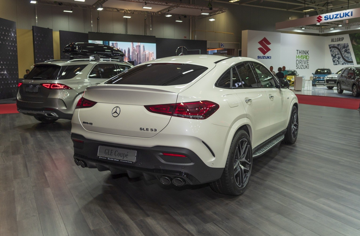 Rear view of a luxury coupe SUV with AMG quad exhausts and sleek taillights