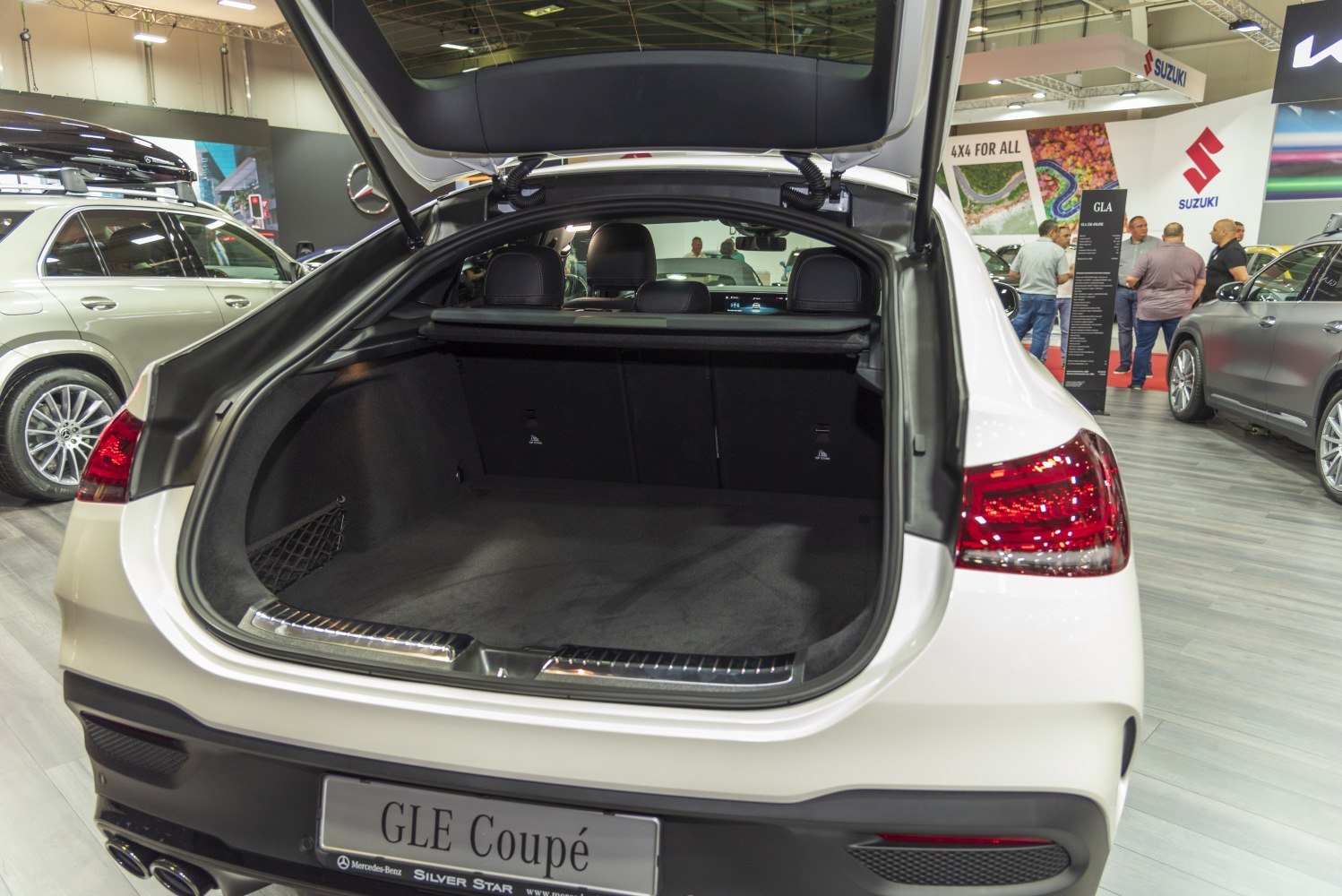 Spacious rear trunk interior with folded seats and cargo cover
