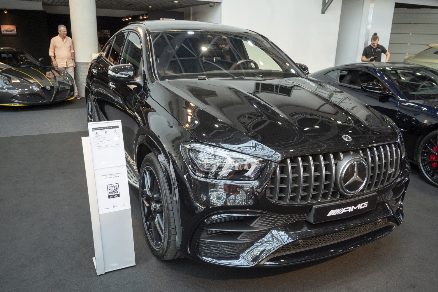 Front grille and LED headlights of black luxury SUV