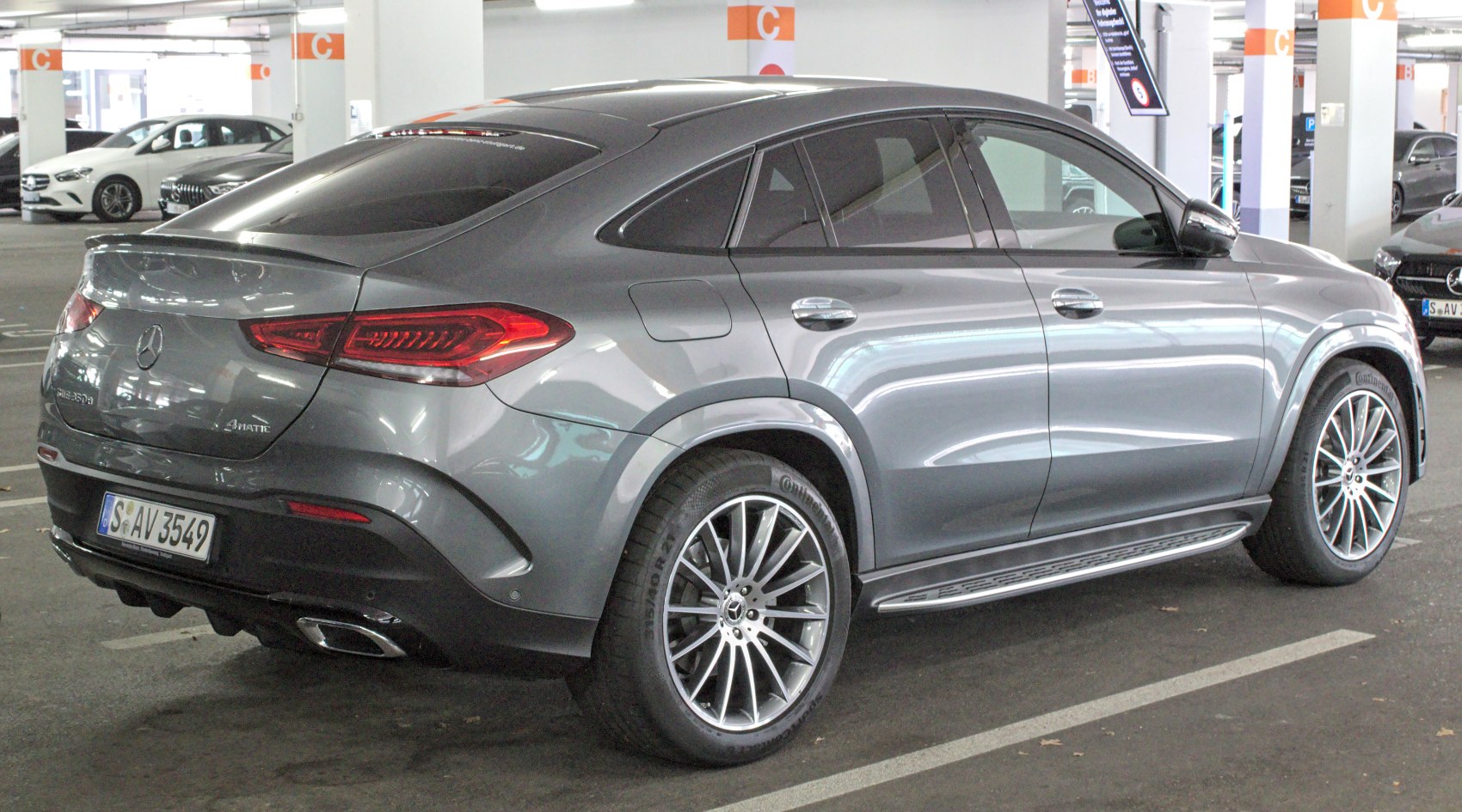 Rear and side view of a sporty SUV with distinctive tail lights and alloy wheels