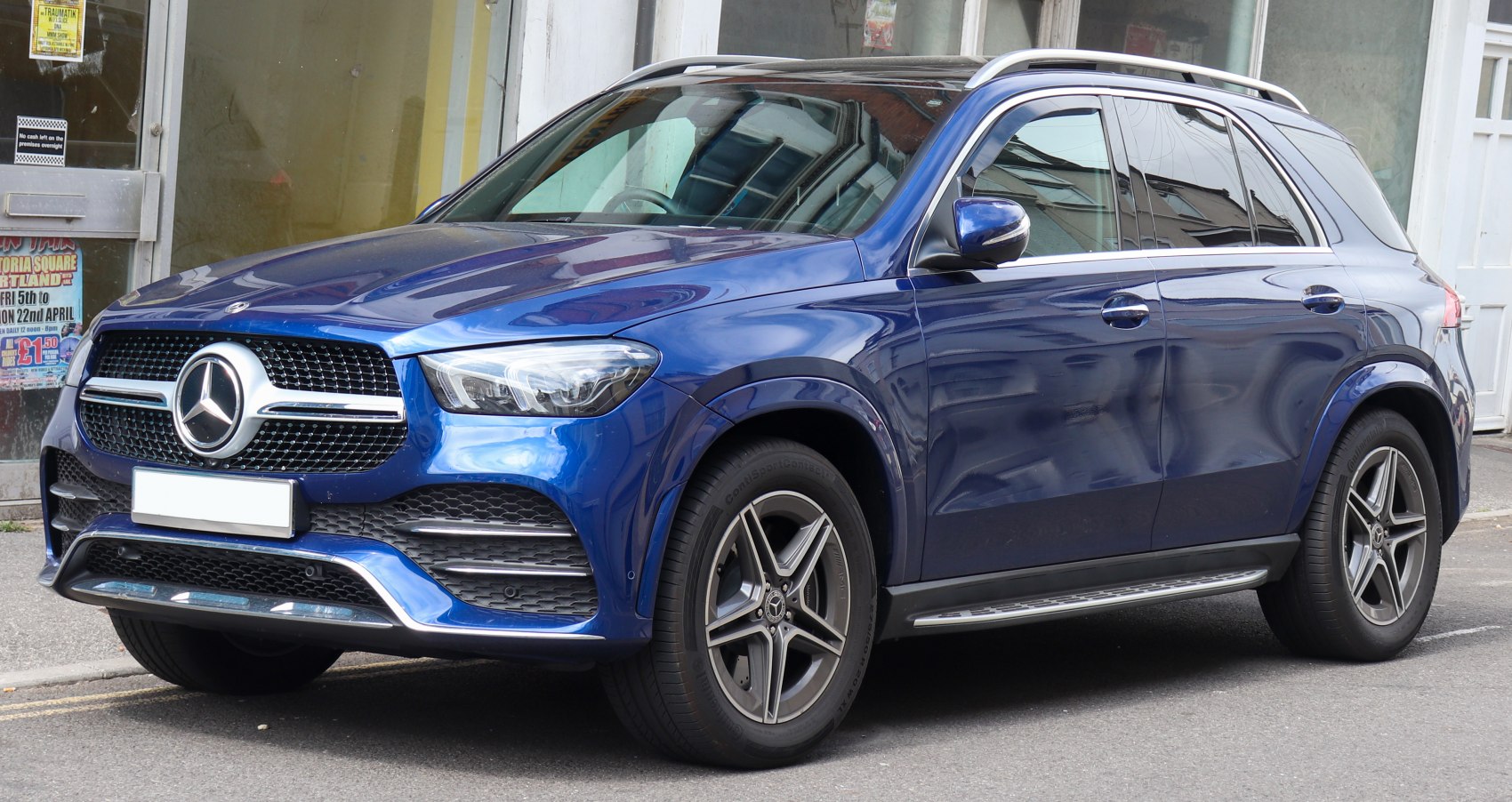 Blue luxury SUV front and side profile with alloy wheels