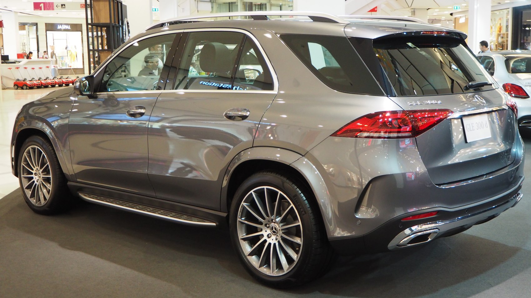 Side and rear view of luxury SUV with modern taillights and alloy wheels