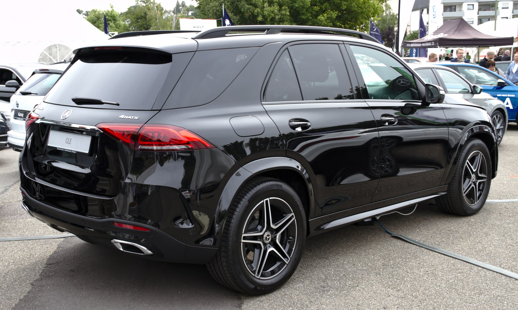 Rear side view of a luxury SUV with 4MATIC badge and alloy wheels