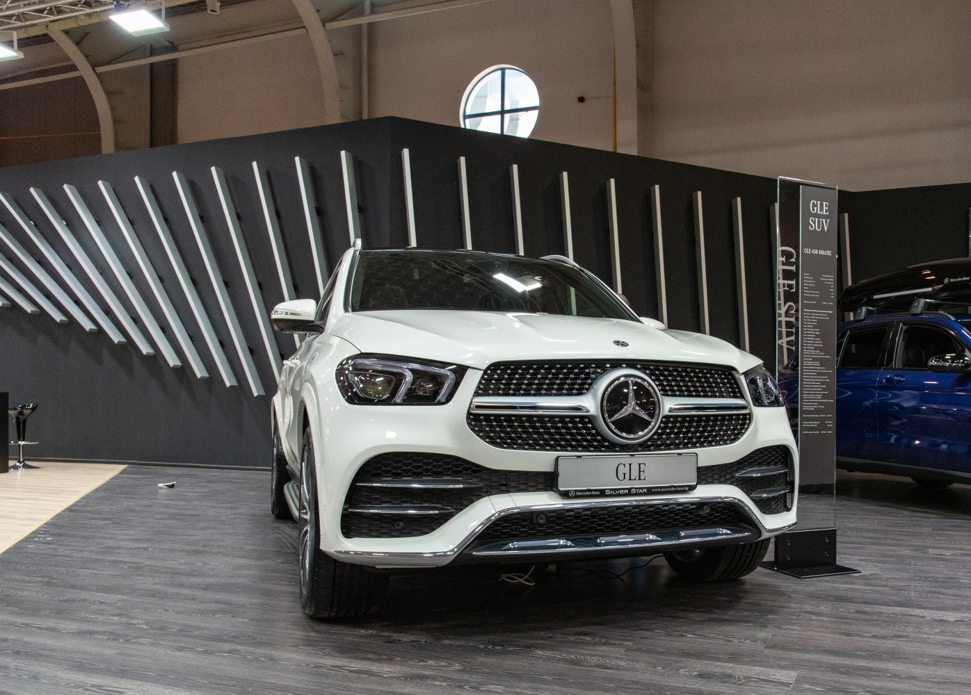 Front angled view of luxury SUV with LED matrix headlights and chrome grille
