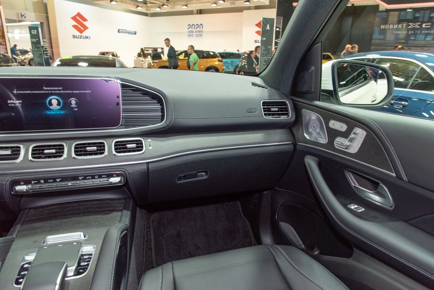 Luxury Mercedes SUV dashboard and door panel interior with digital display and control buttons