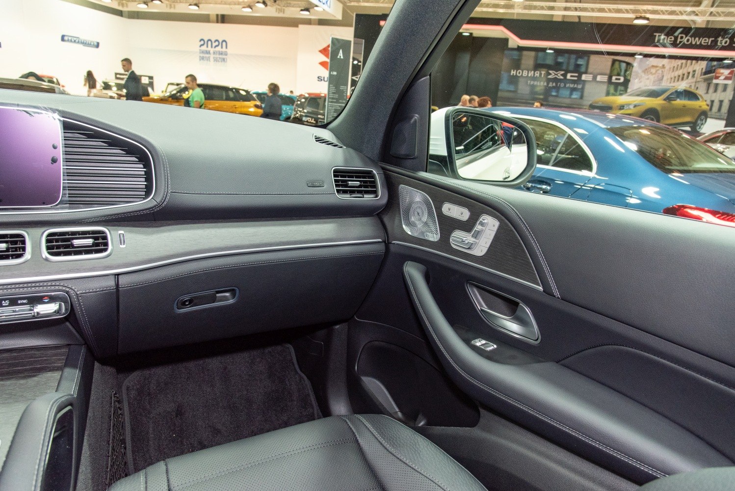 Luxury SUV interior with advanced seat controls and premium materials