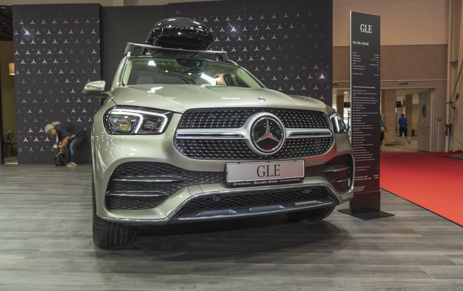 Luxury SUV front showing grille with large emblem and LED headlights