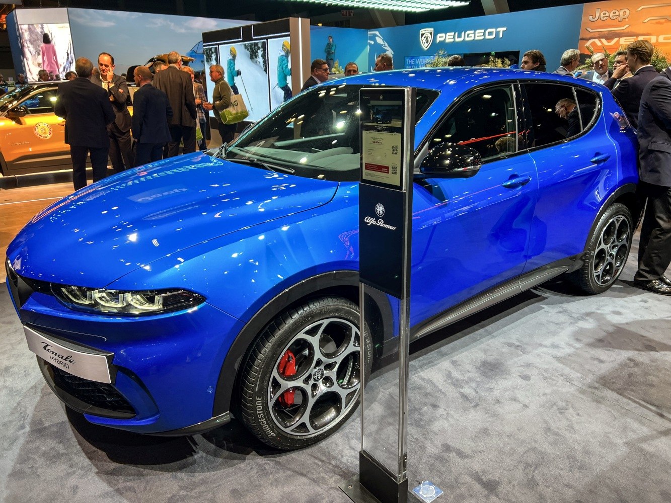 Blue compact SUV front side profile with LED headlamps and distinctive alloy wheels