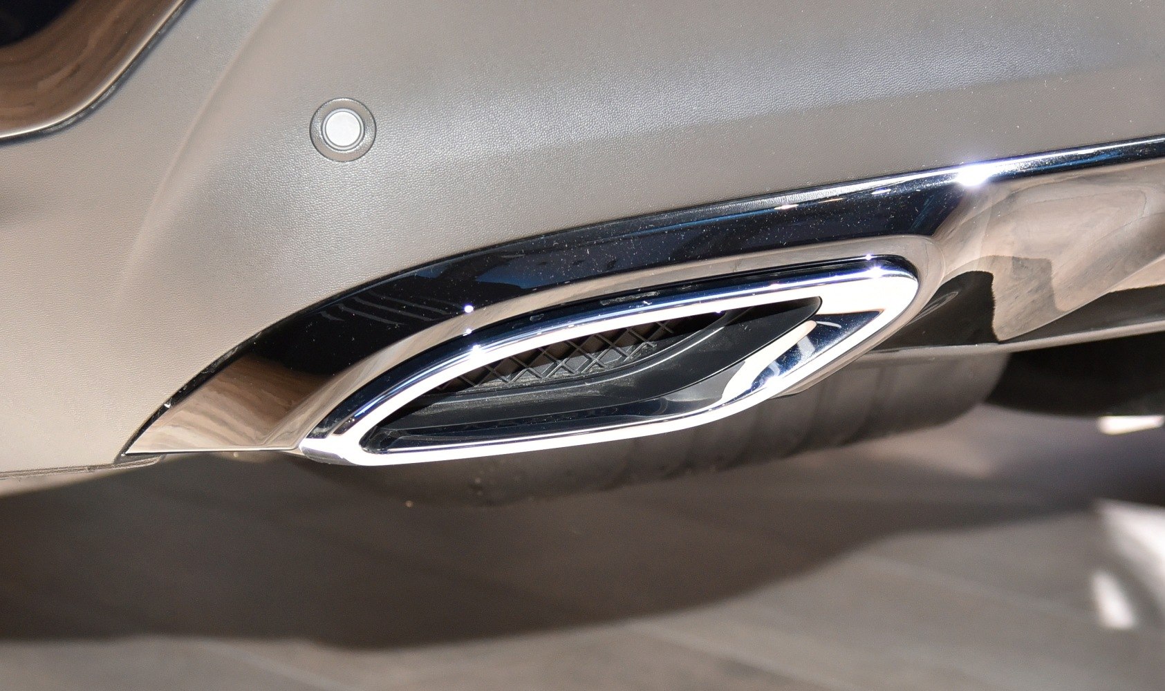 Chrome exhaust tailpipe of luxury SUV