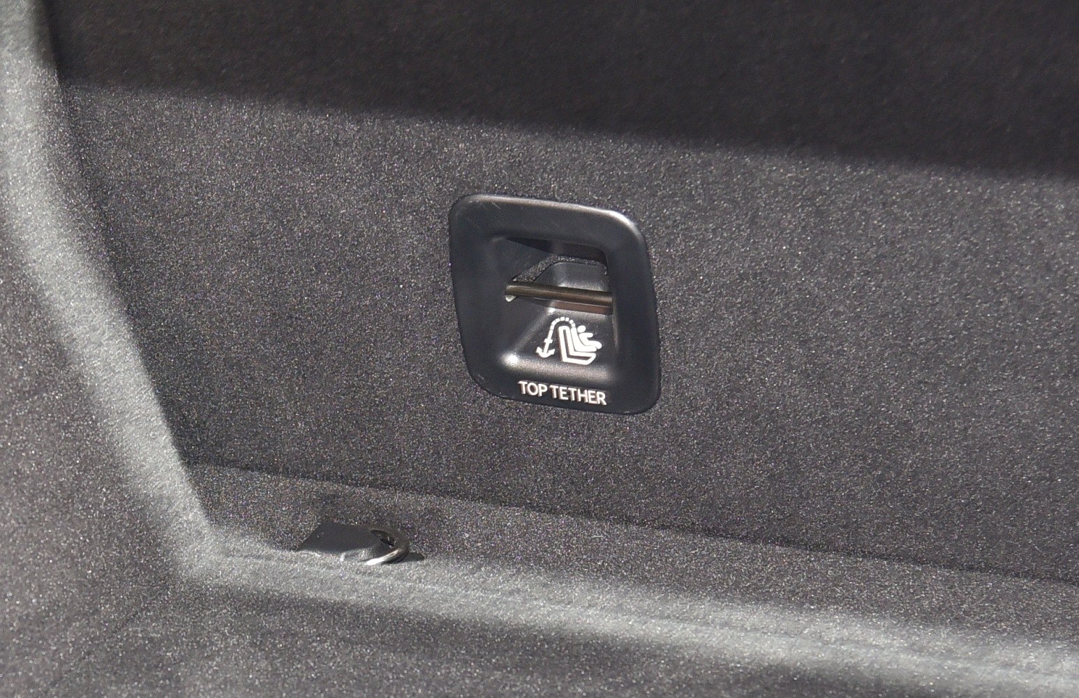 Child seat top tether anchor point in vehicle interior