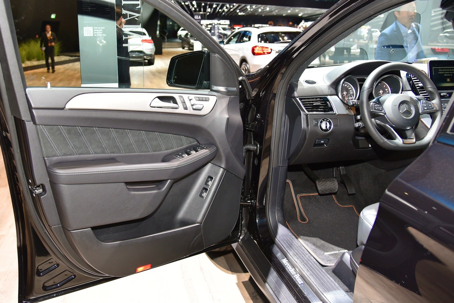 Interior door panel and driver controls of a luxury SUV