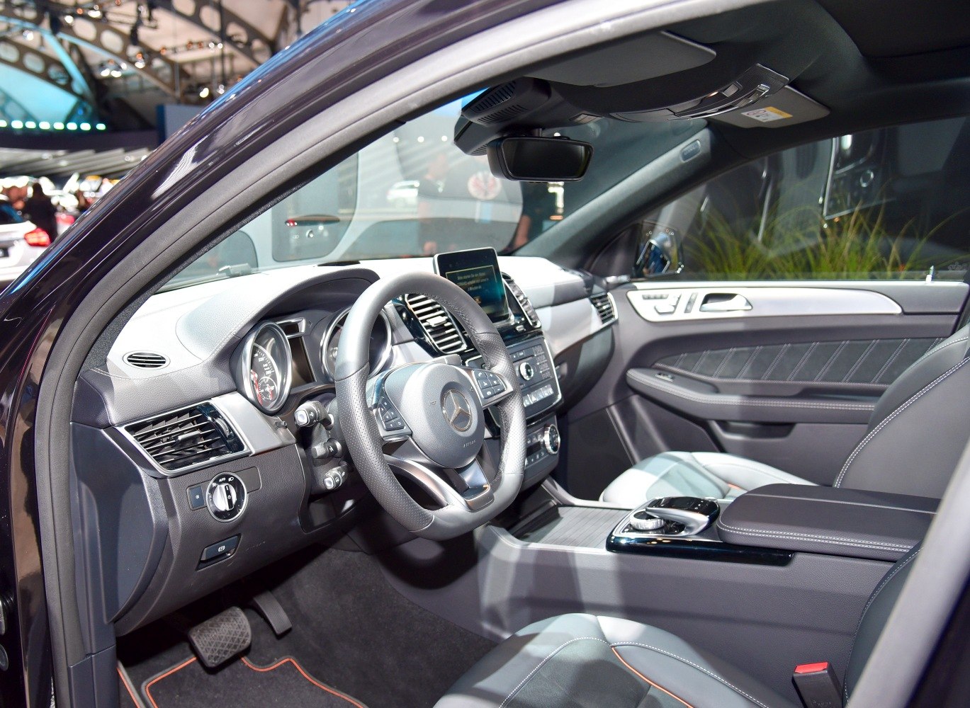 Luxury car interior with advanced dashboard and steering wheel controls