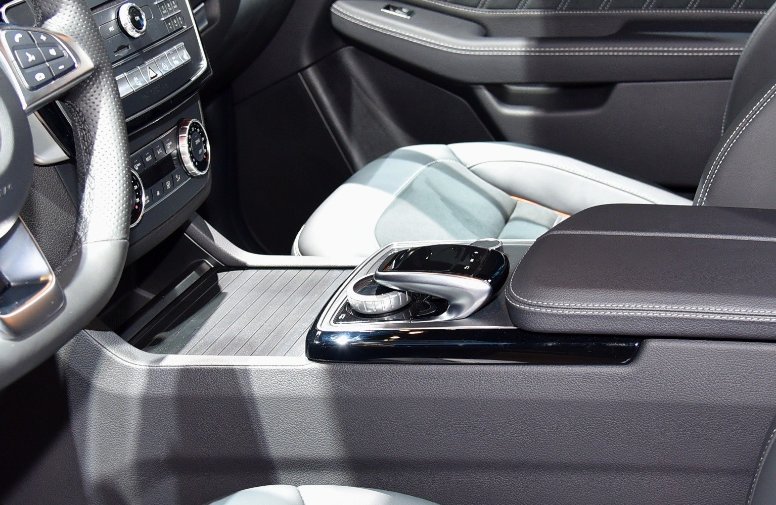 Luxury center console with modern gear selector and control knob