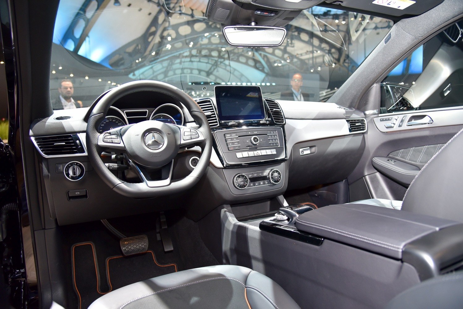 Luxury car interior with dashboard, steering wheel, center console