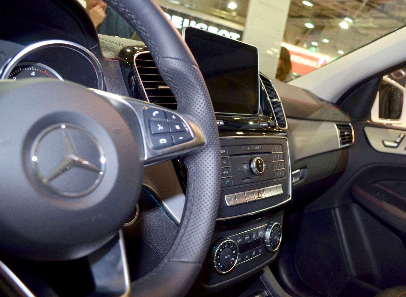 Dashboard and steering wheel with multifunction buttons and climate controls