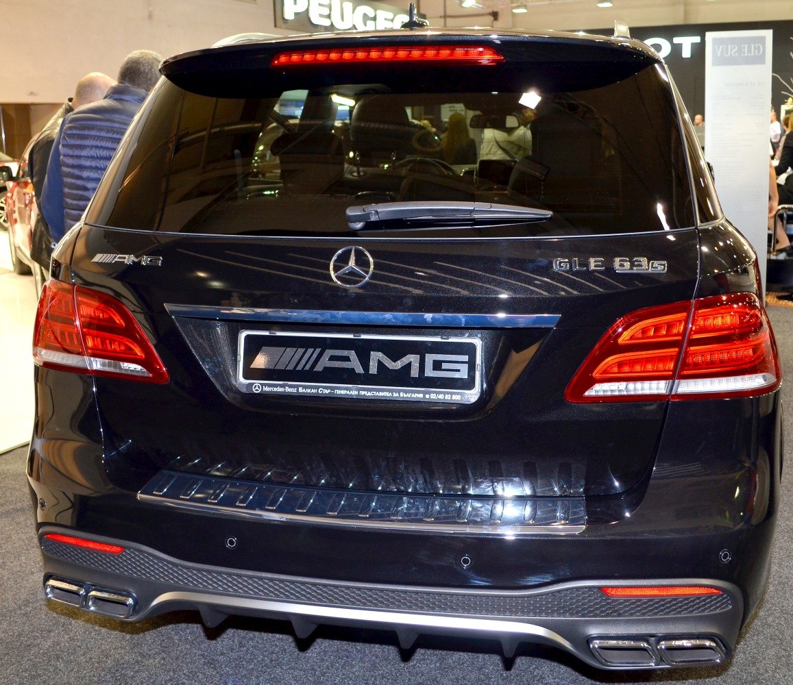 Rear view with AMG badges, distinct tail lights, and quad exhaust tips