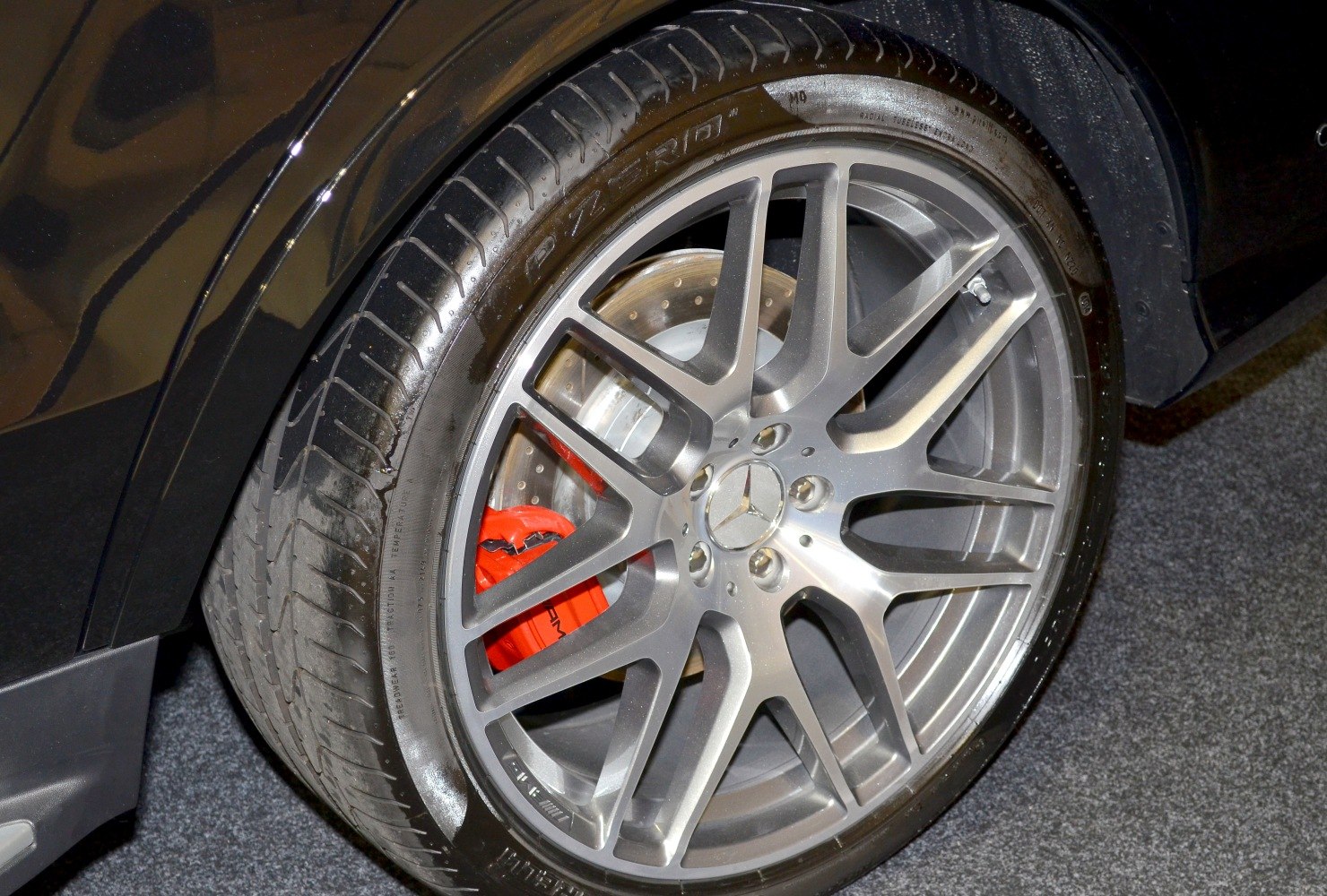 Close-up of alloy wheel with red performance brake caliper