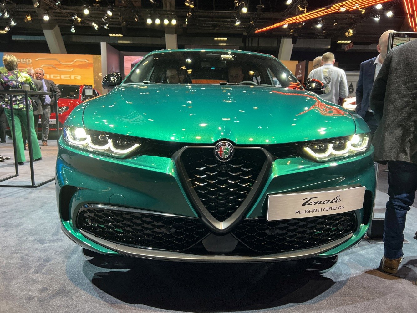 Front view with LED headlights and signature triangular grille.