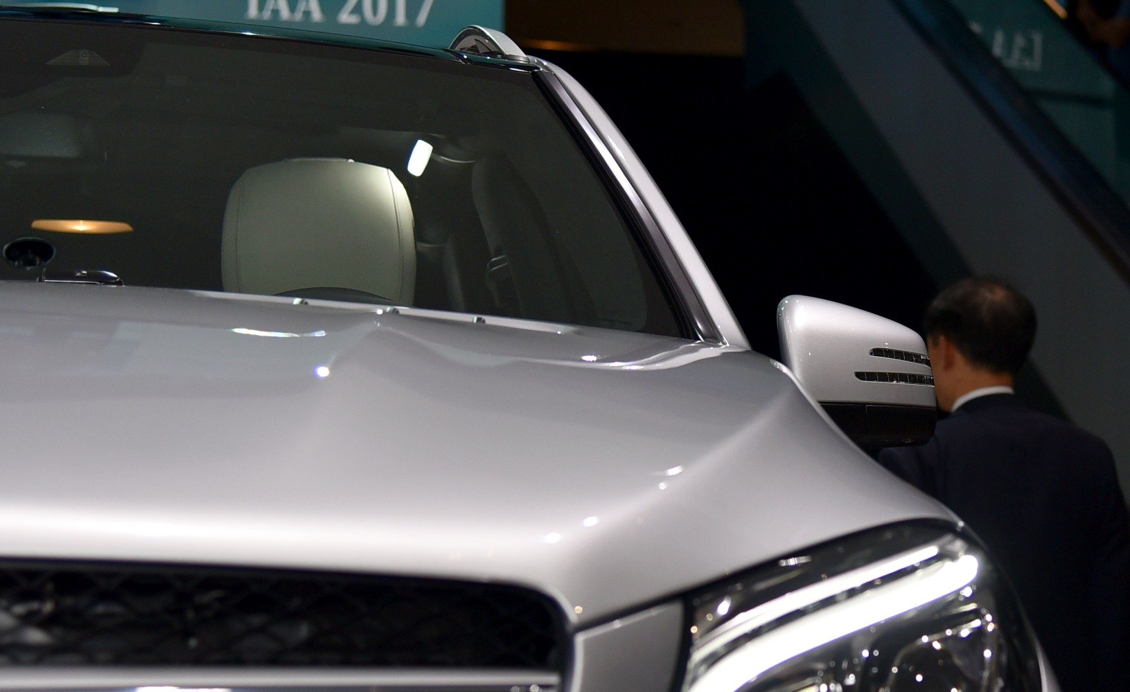 Front view with LED headlights and side mirror of a modern SUV