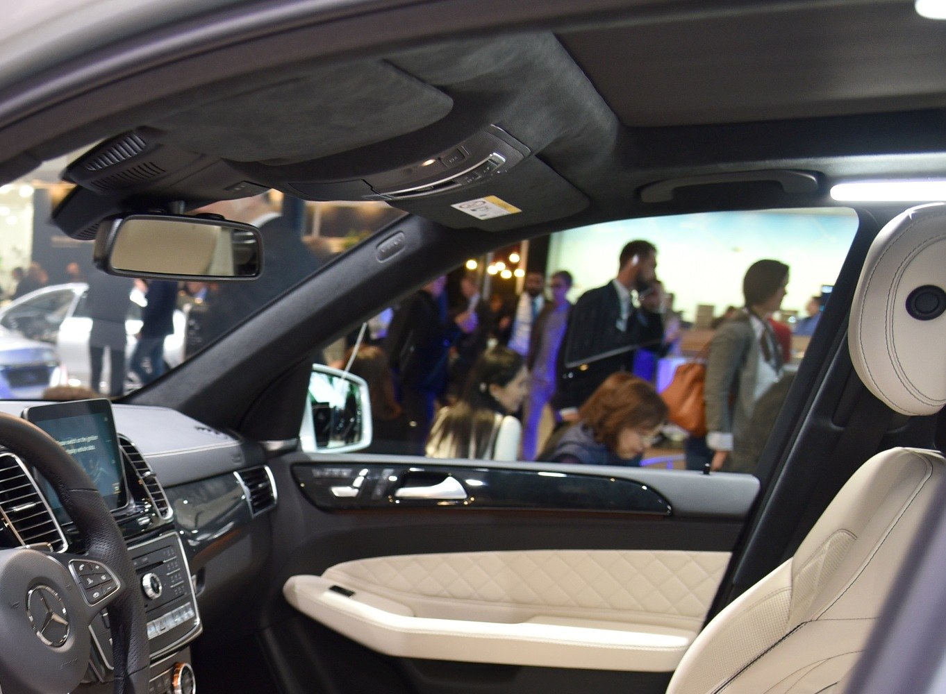 Luxury SUV interior with quilted leather seats and advanced controls