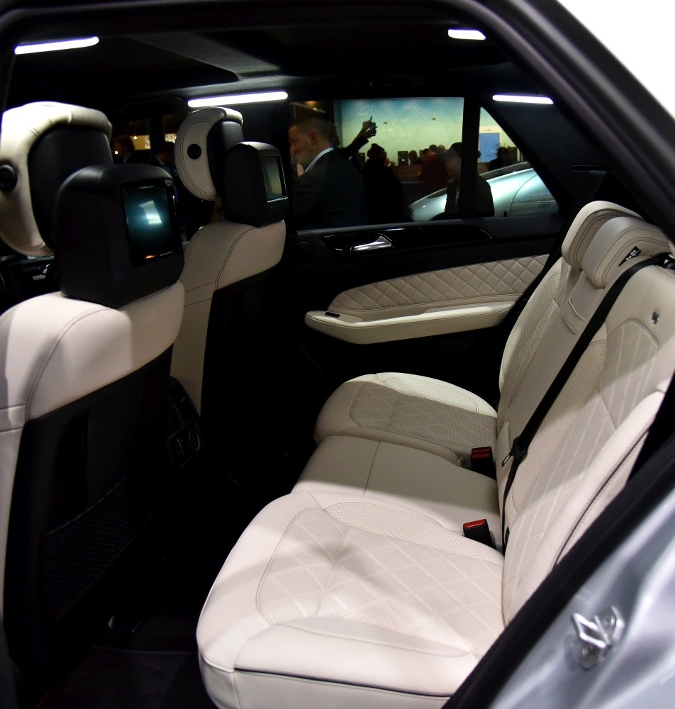 Luxurious rear seats with headrest monitors and quilted leather upholstery