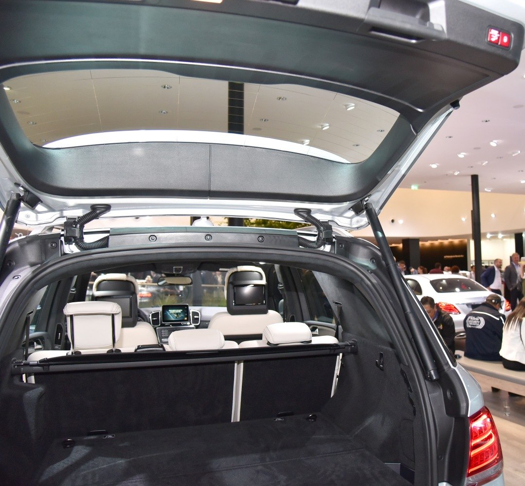 Spacious rear cargo area with folding seats and headrests in a luxury SUV