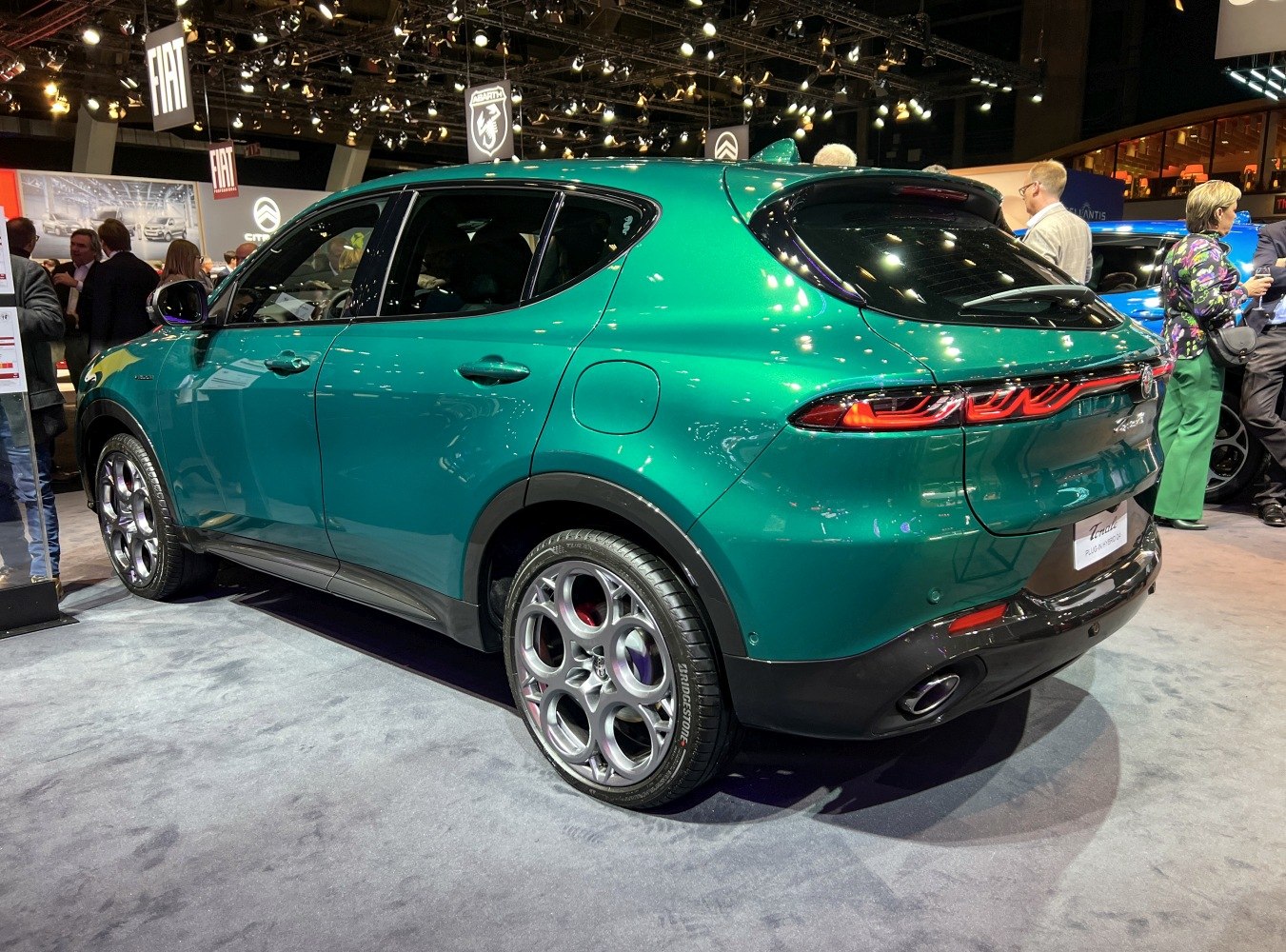 Rear and side view with signature tail lights and circular alloy wheels