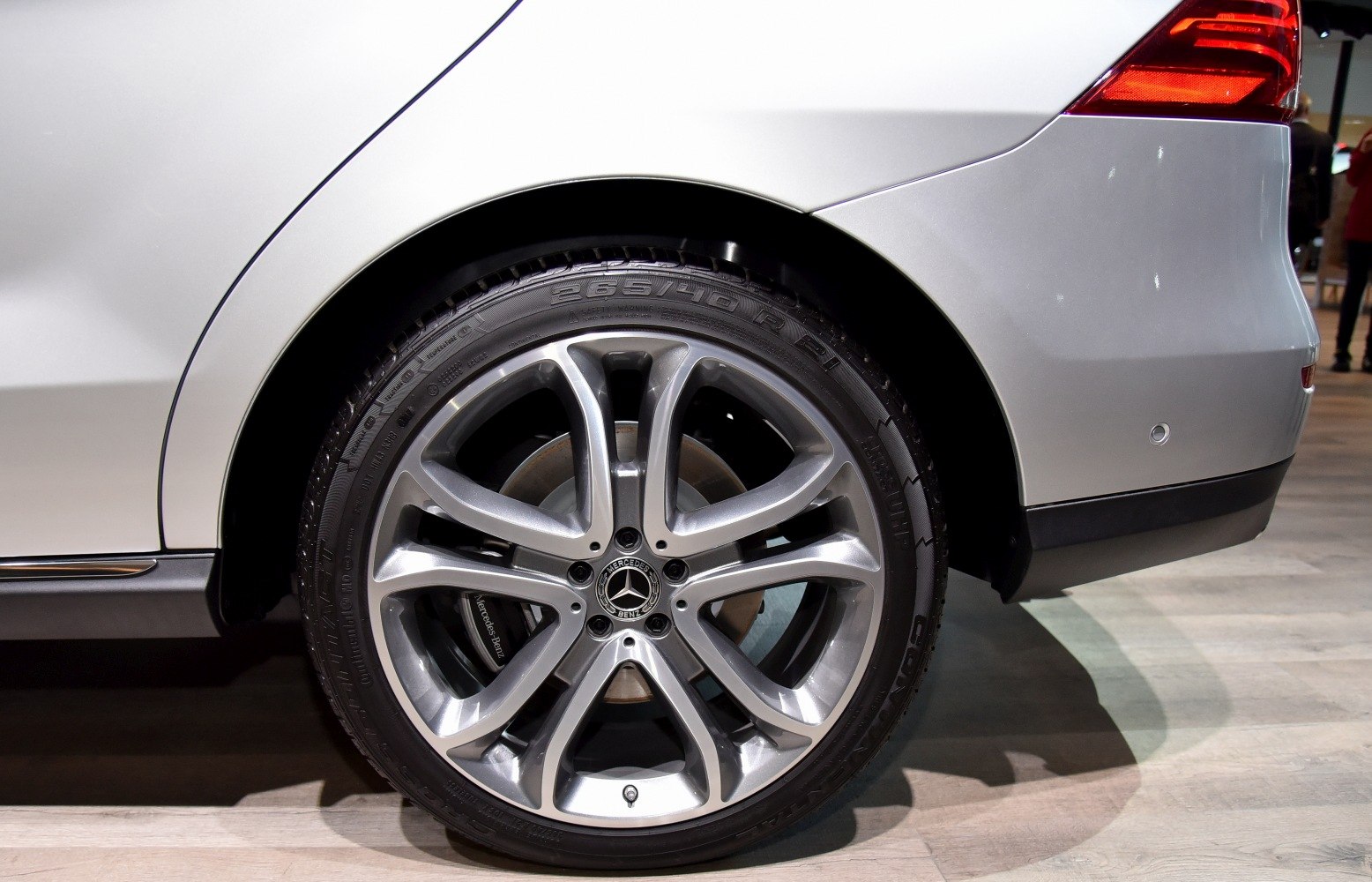 Close-up of rear alloy wheel rim and taillight