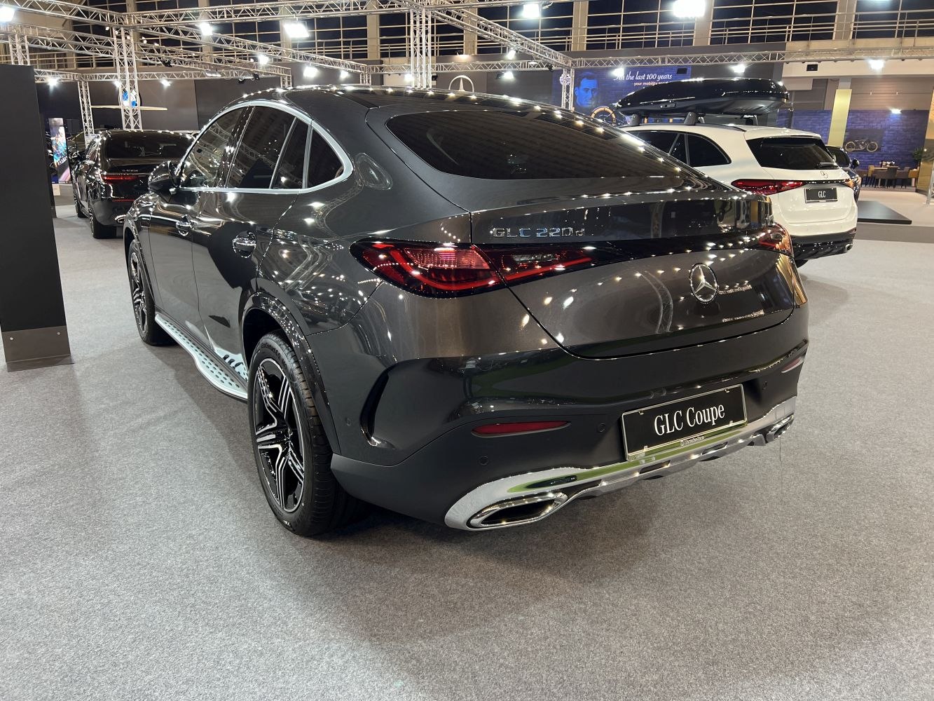 Luxury SUV coupe rear with dual exhaust and modern tail lights