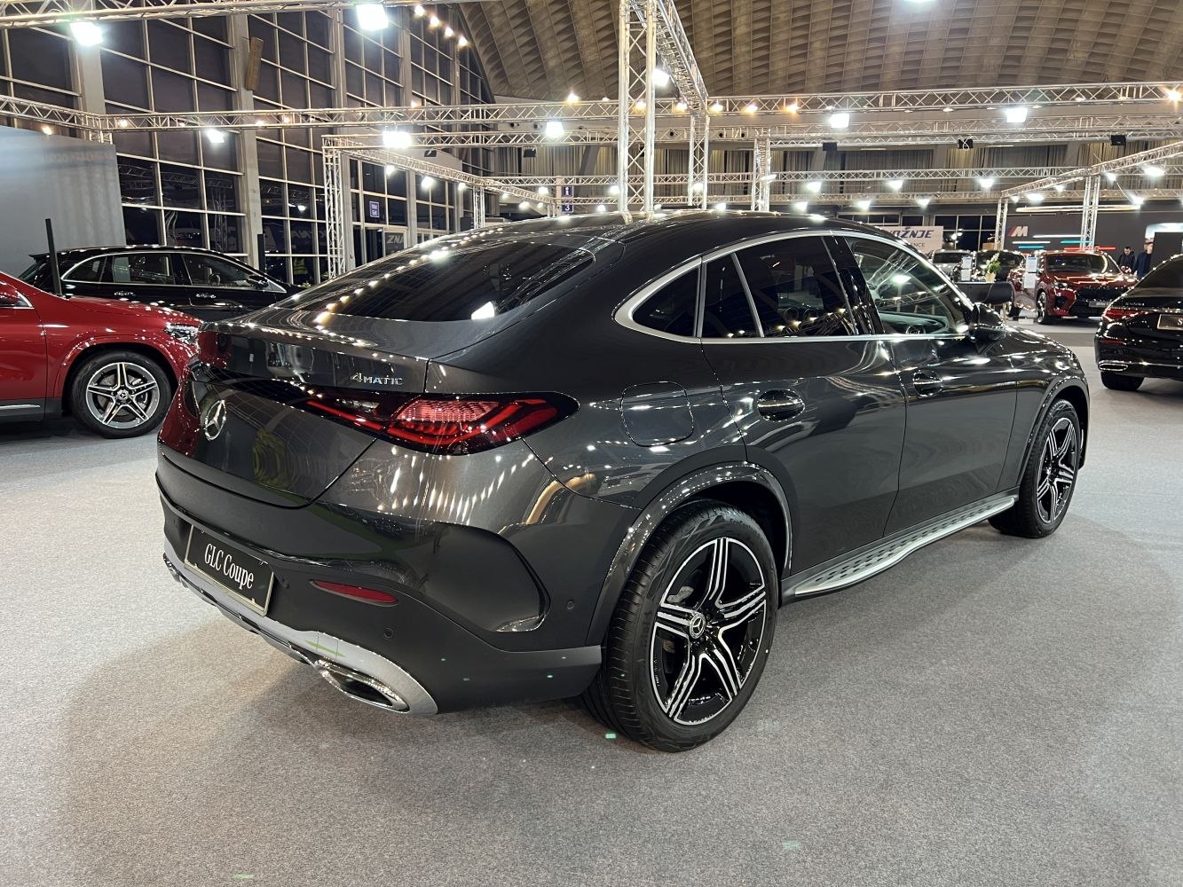 Rear profile and 4MATIC badge on luxury coupe SUV with distinctive taillights and alloy wheels