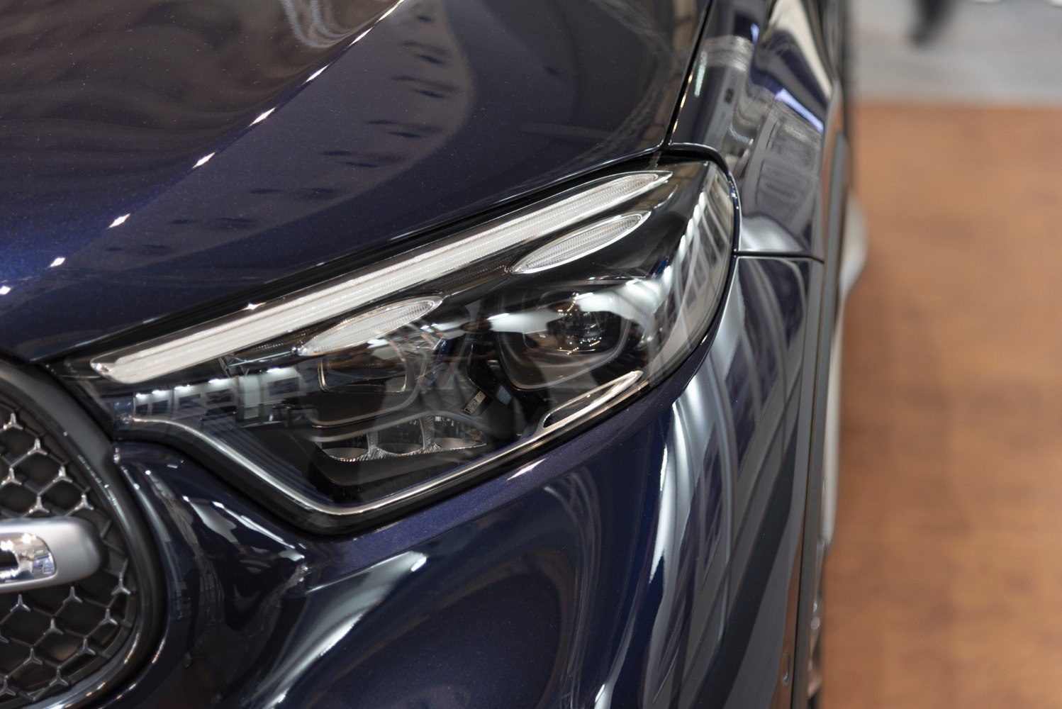 Close-up of a modern luxury SUV headlight with LED elements
