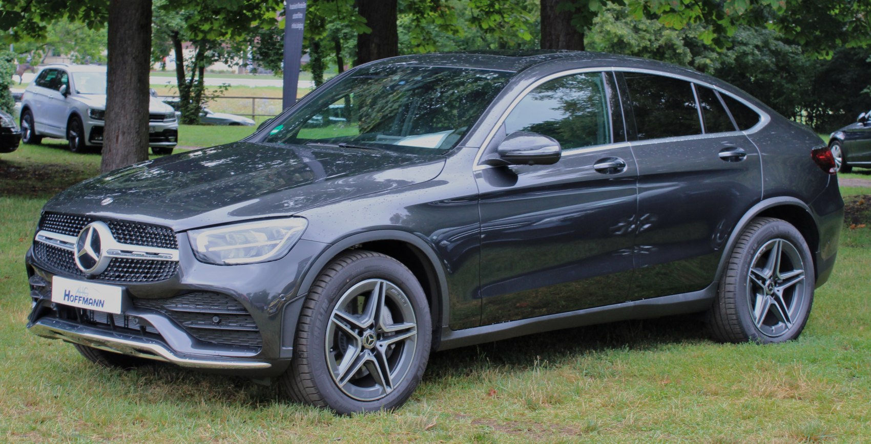 Front and side view of a mid-size SUV coupe with alloy wheels and LED headlights