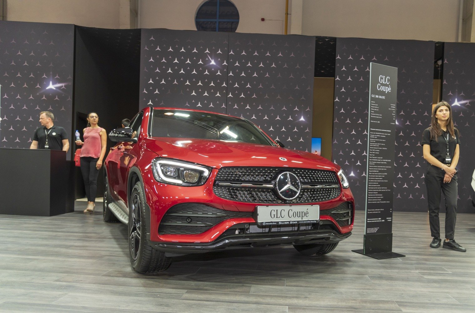 Red SUV front view with LED headlights and distinctive grille