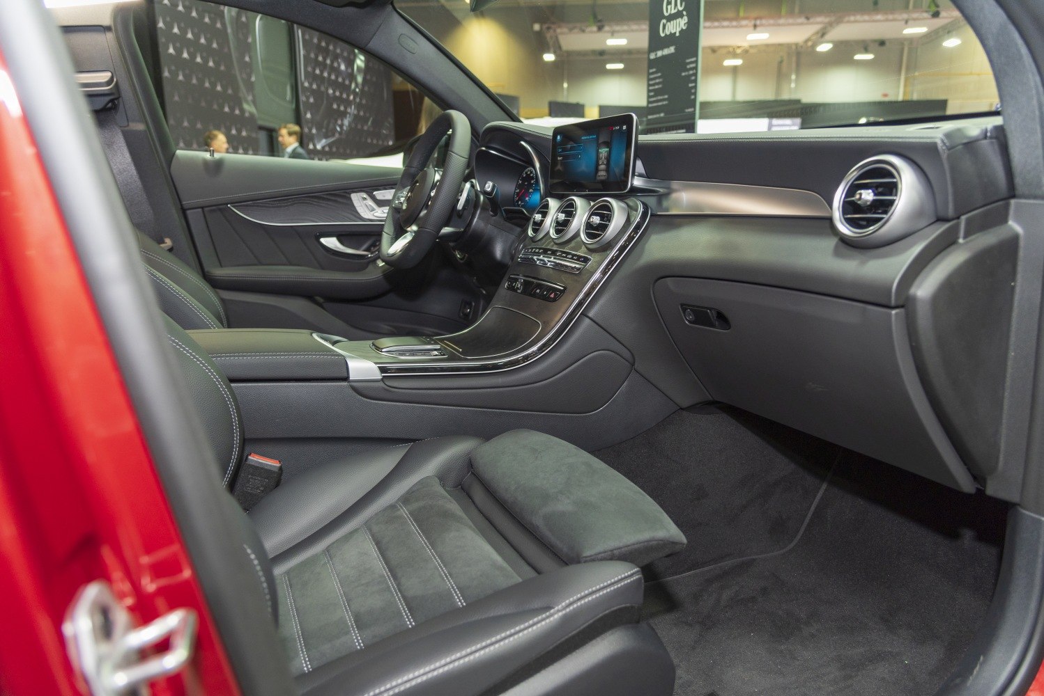 Luxurious black leather interior with modern dashboard and infotainment display