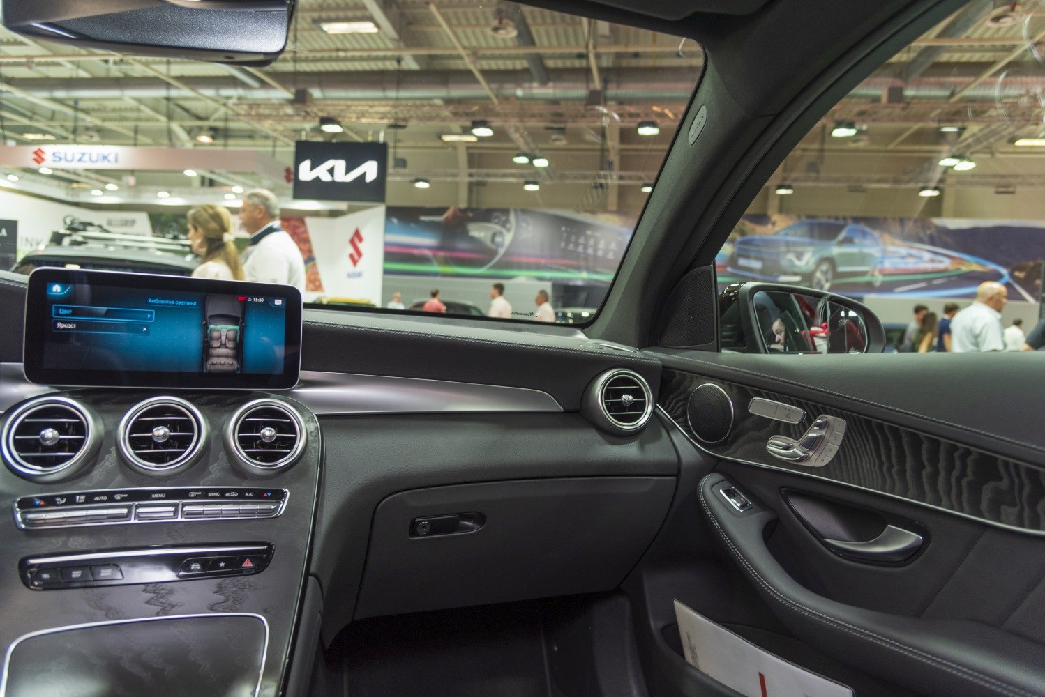 Dashboard and digital infotainment screen with climate control and door panel.