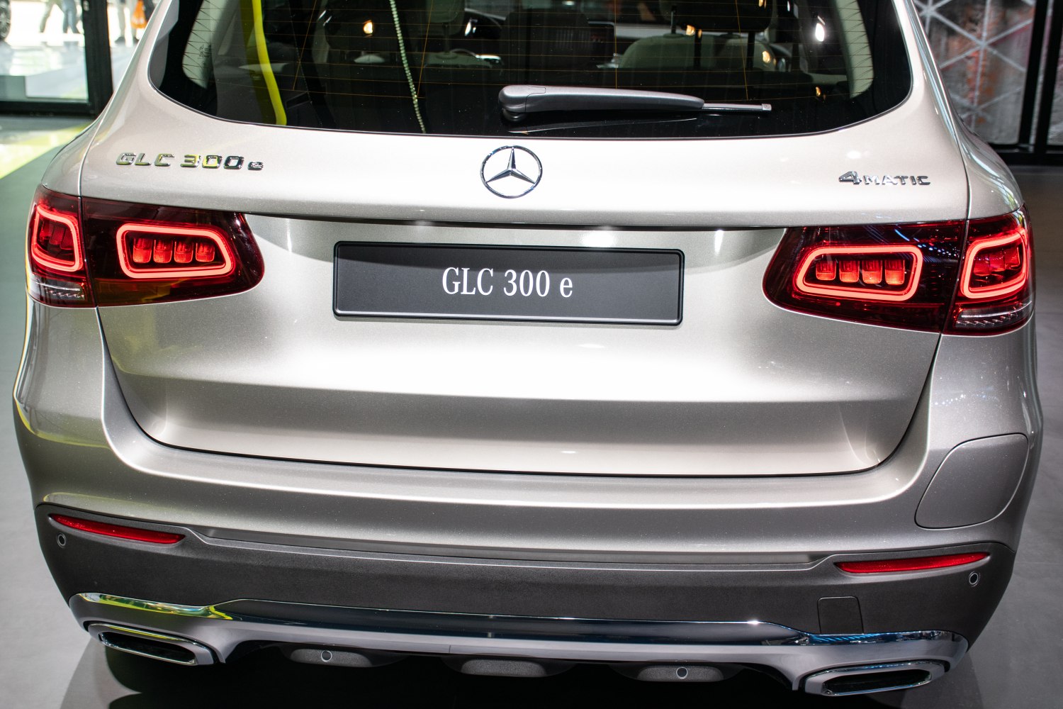 Illuminated LED tail lights and dual exhaust outlets on SUV rear