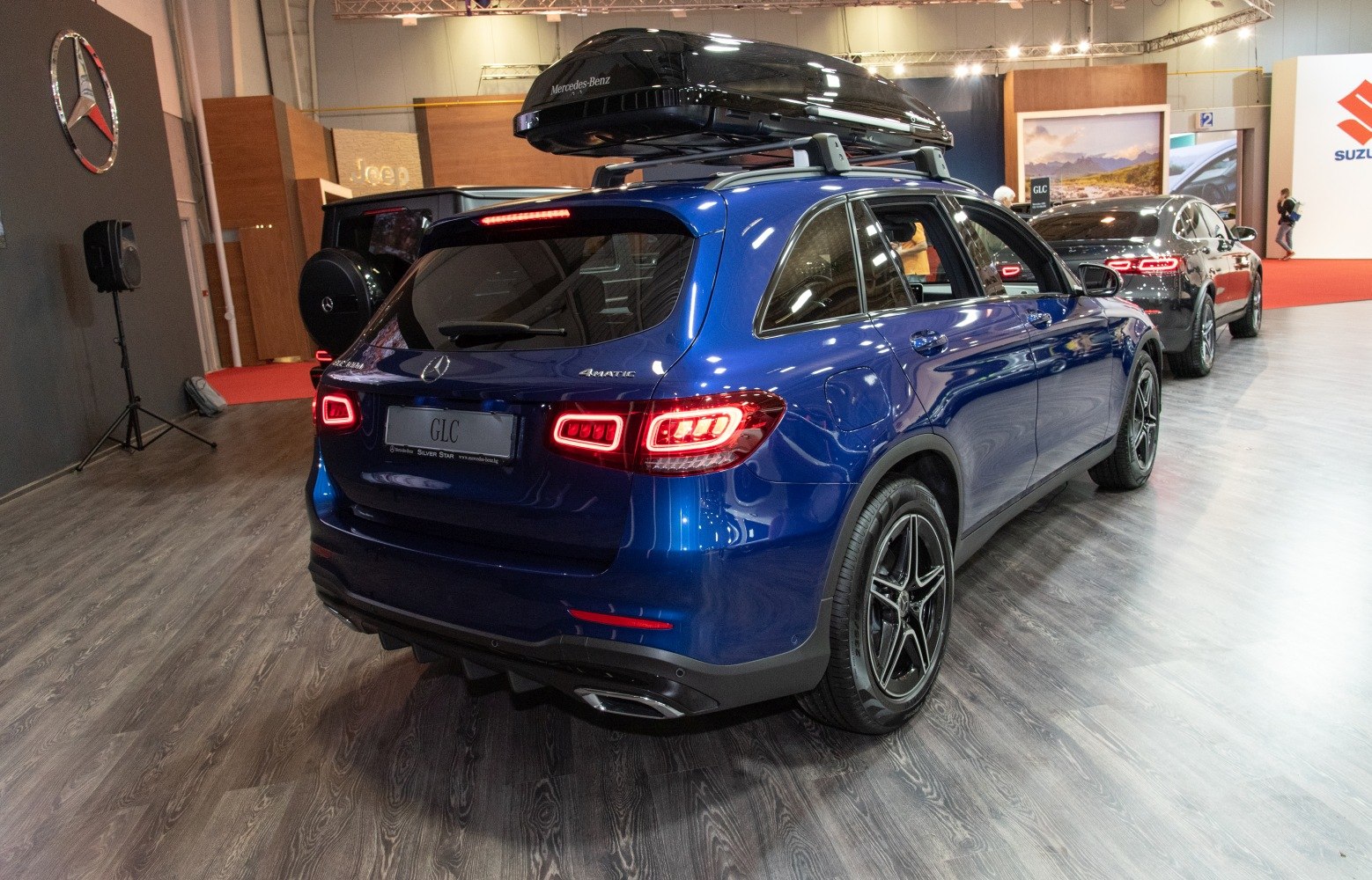 Rear view of SUV with distinctive LED taillights and roof box