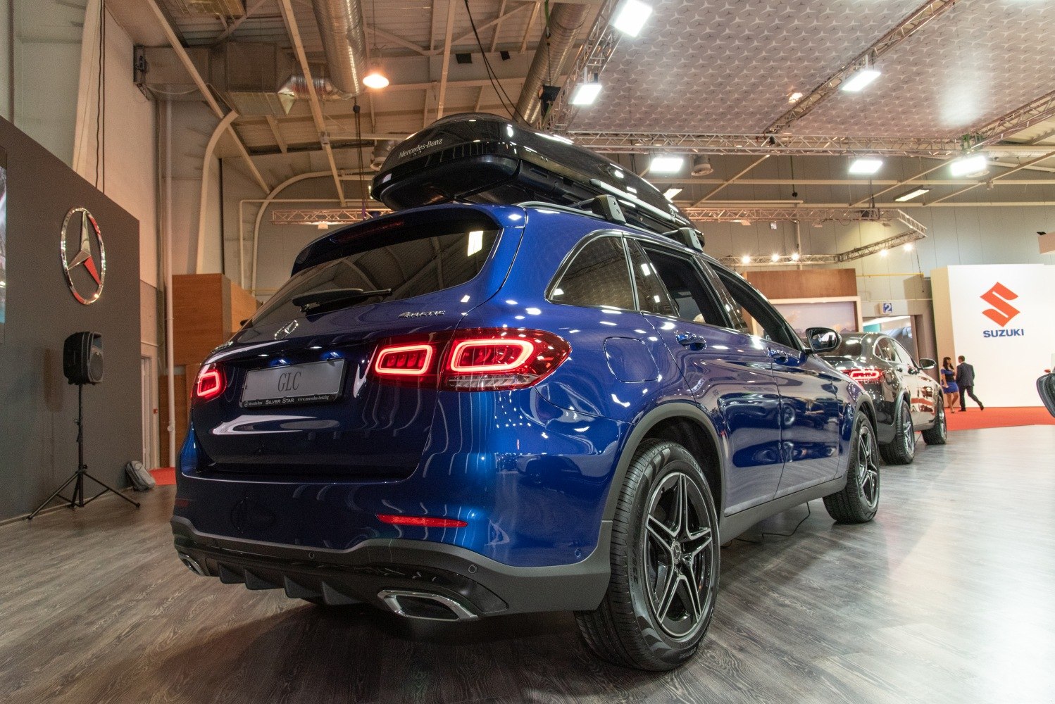 Rear view of SUV with LED taillights and roof cargo box