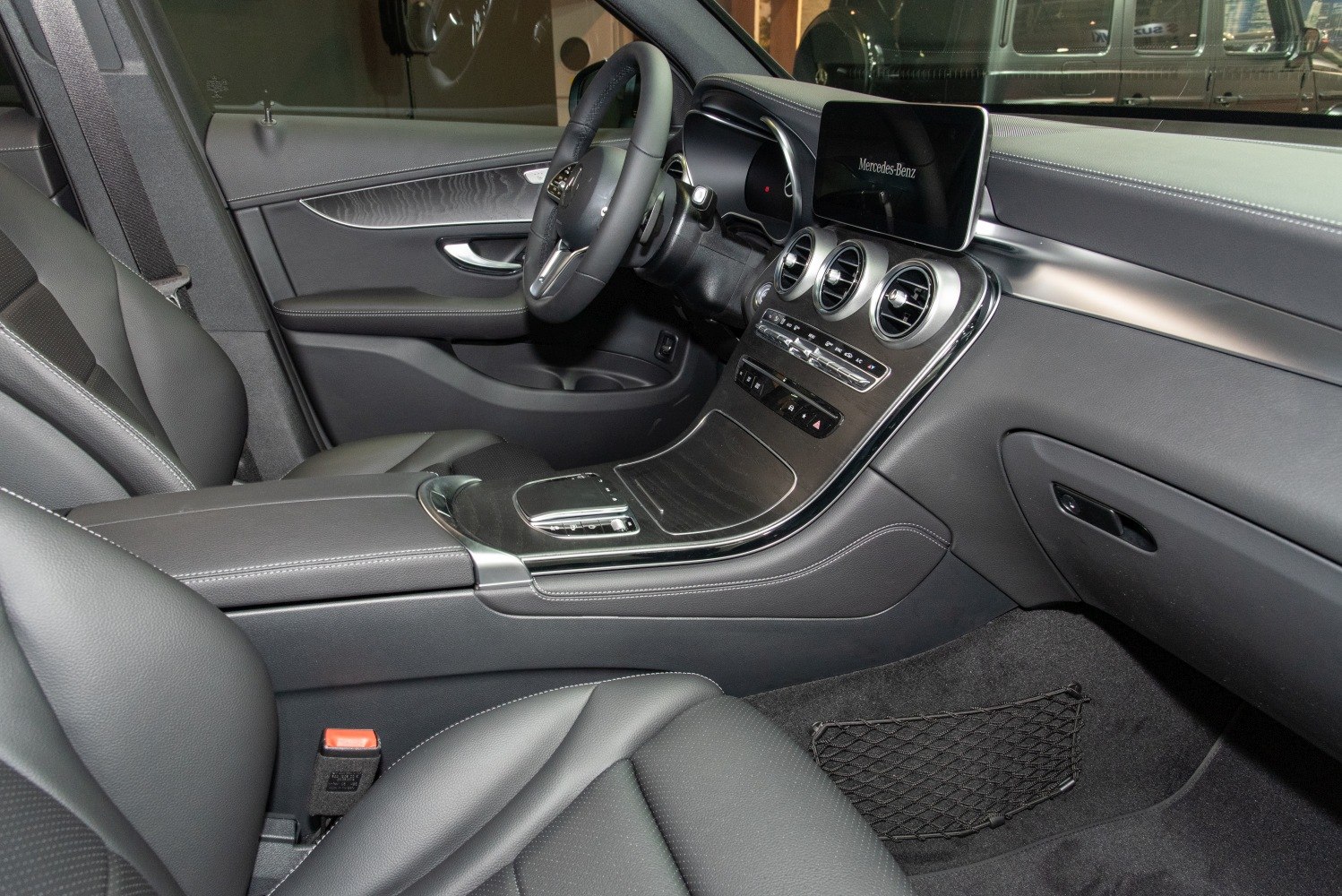 Black leather interior with dashboard and infotainment screen