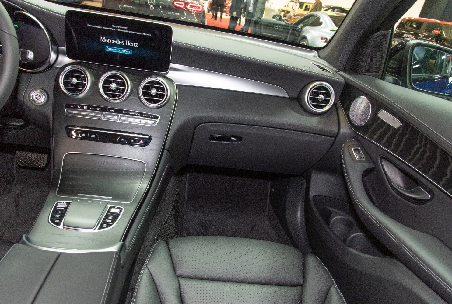 Luxury car interior dashboard with infotainment screen and climate control vents
