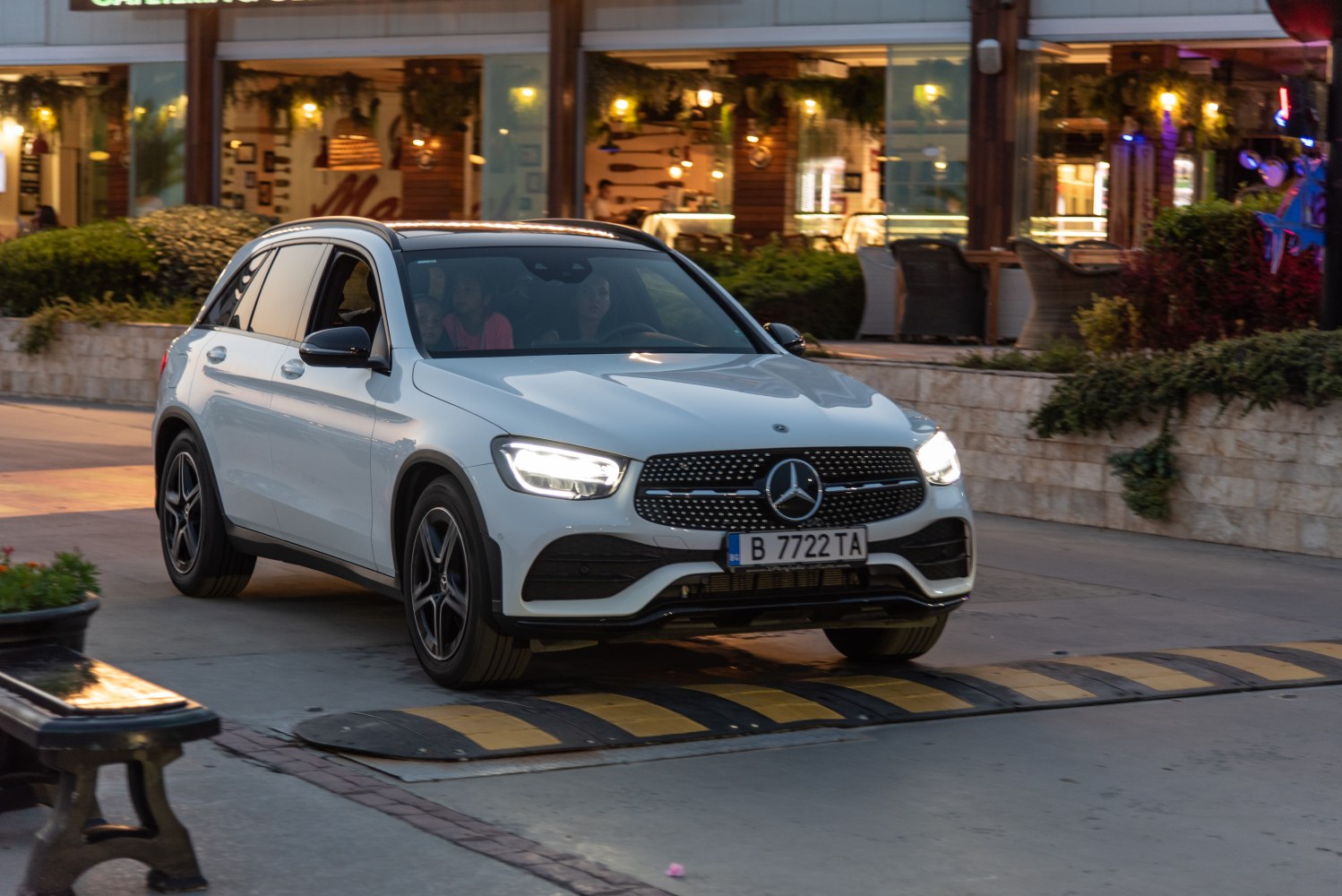 White SUV front view with LED headlights and detailed grille design
