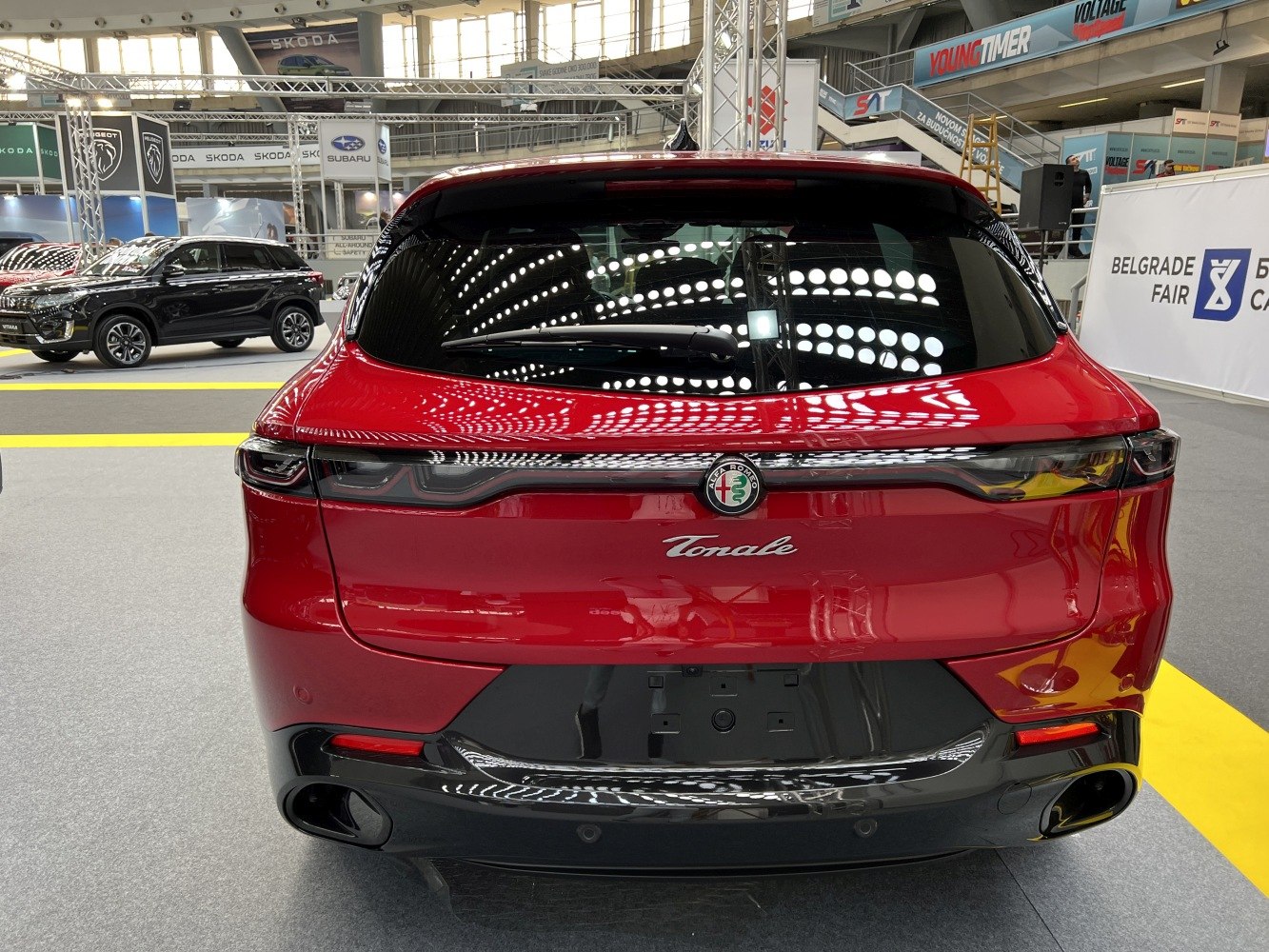 Sleek rear design with continuous LED tail lights and dual sporty exhausts.