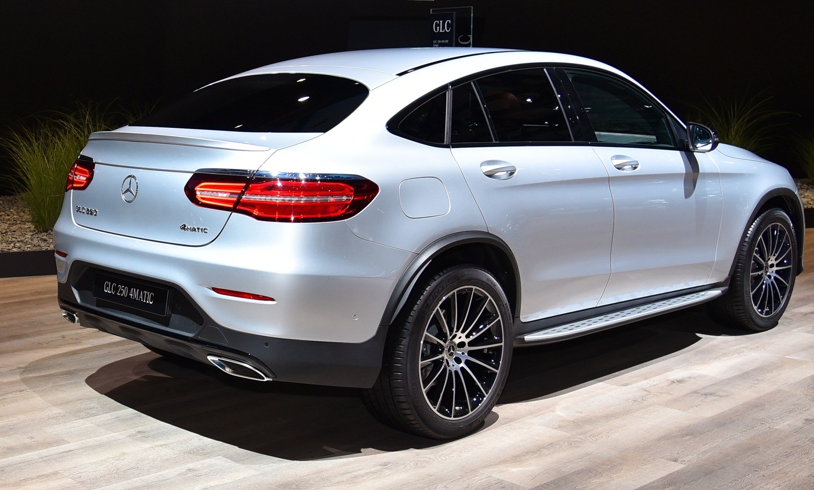 Rear side view of a sporty SUV coupe with distinctive taillights and alloy wheels