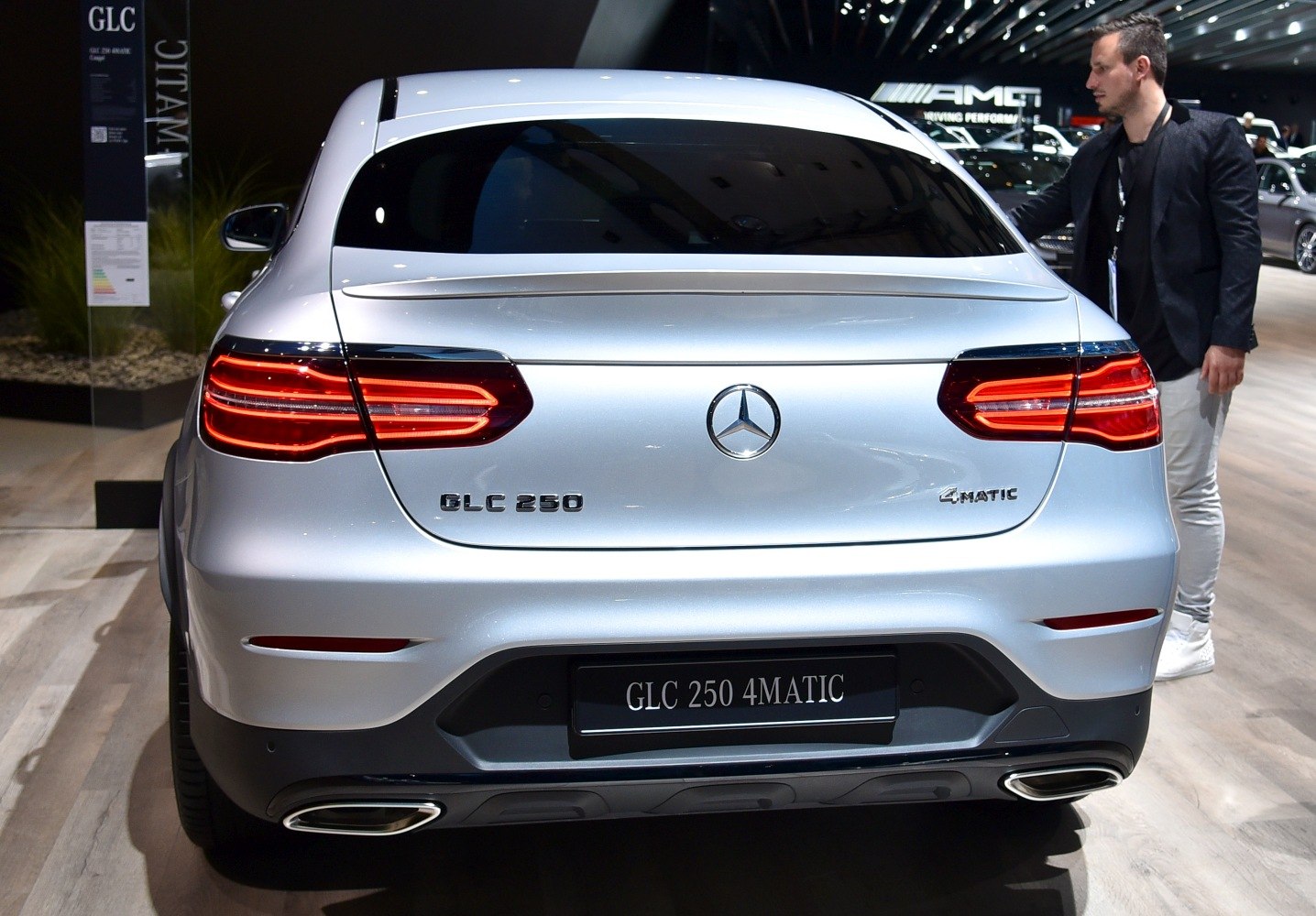 Rear view of SUV with LED taillights, dual exhausts, and rear spoiler