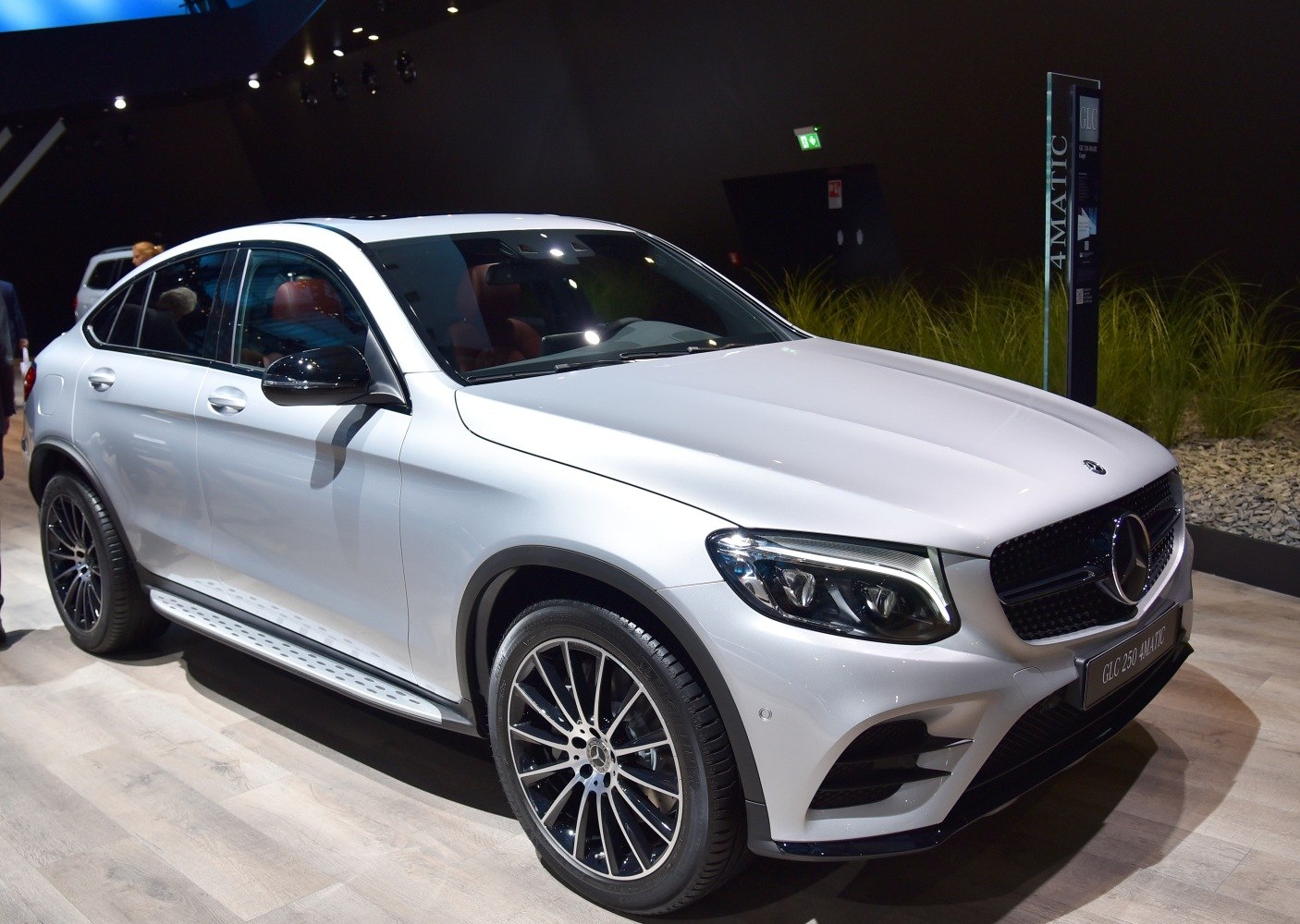White SUV coupe showing front-side view with sporty rims