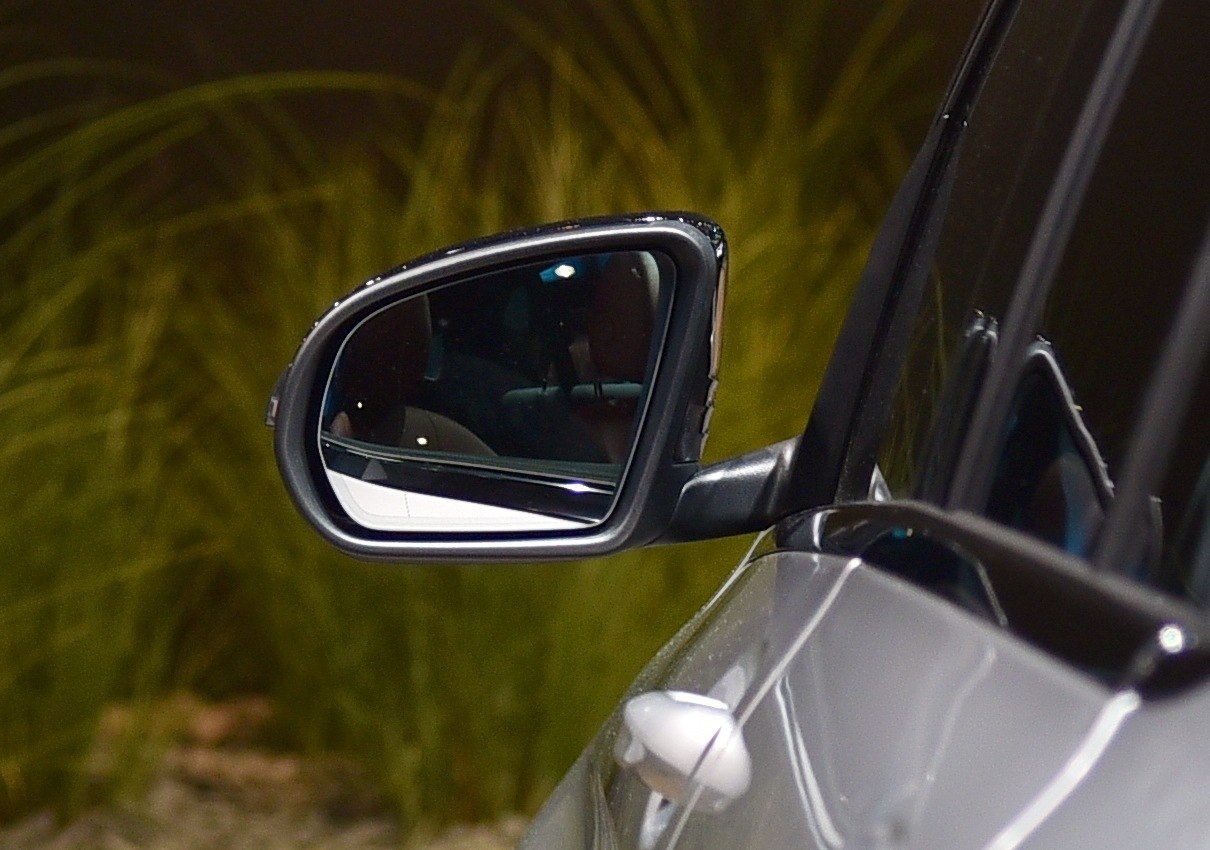 Close-up of side mirror and part of door on vehicle