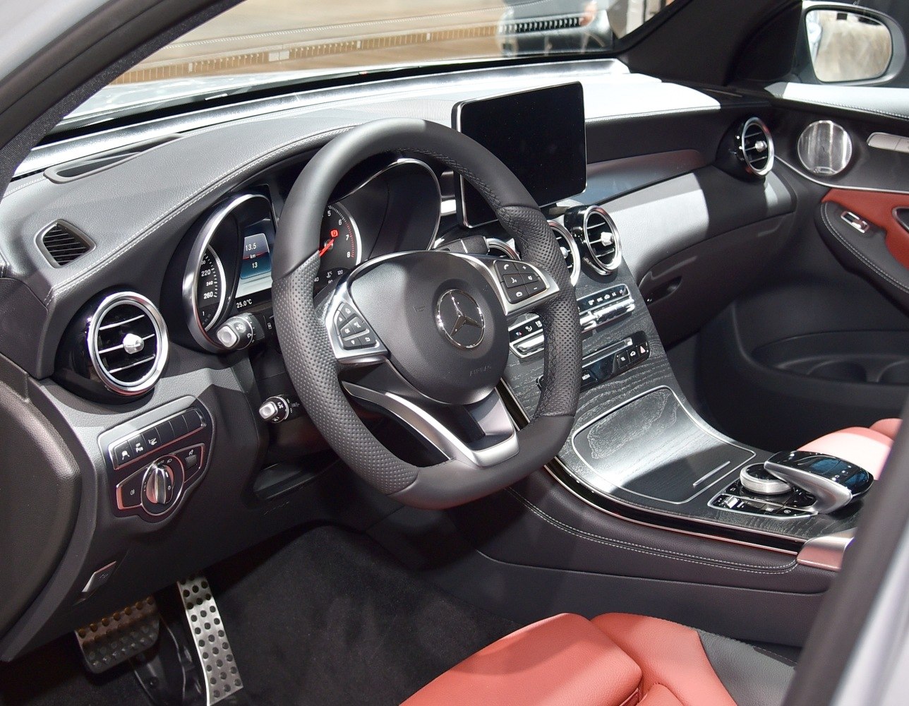 Modern dashboard and multifunction steering wheel in luxury car interior