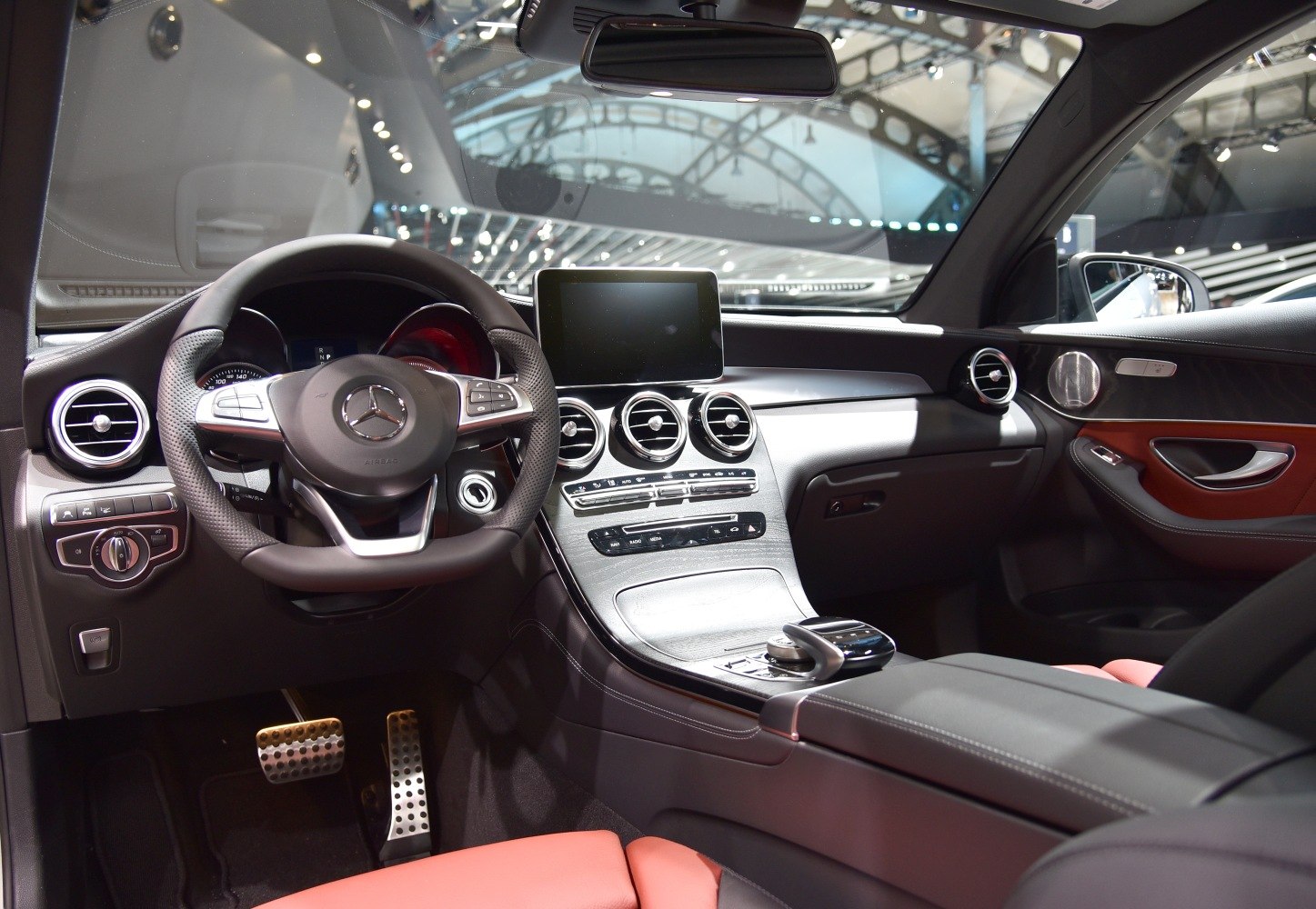 Luxury car interior with dashboard and multifunction steering wheel