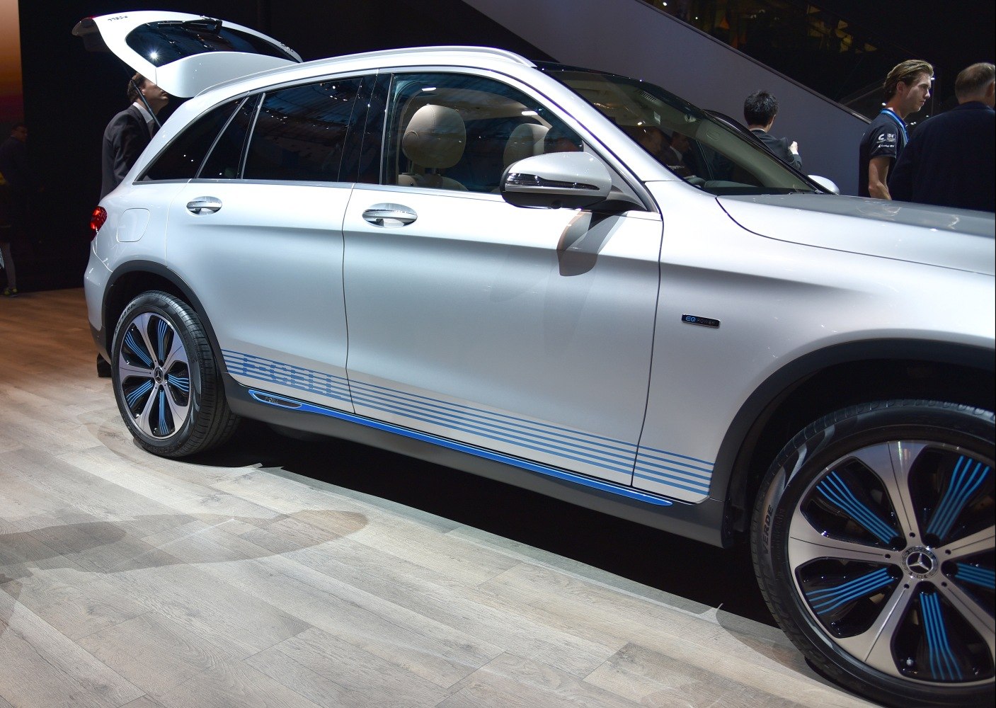 Side profile with blue-striped decals and blue-accented wheels